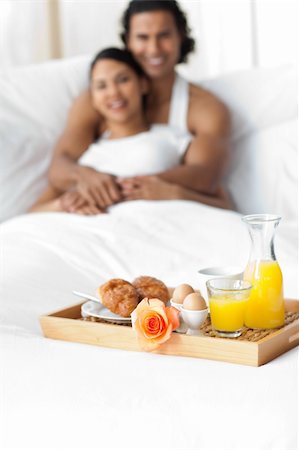 Happy couple having breakfast on the bed Stock Photo - Budget Royalty-Free & Subscription, Code: 400-04193449