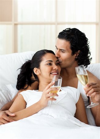 simsearch:400-04150404,k - Man kissing his wife and drinking Champagne on the bed Stock Photo - Budget Royalty-Free & Subscription, Code: 400-04193457