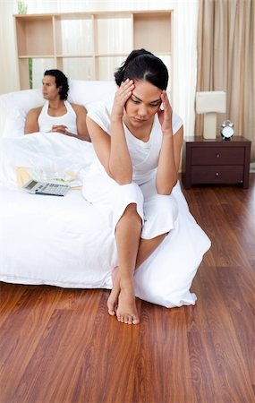 simsearch:400-05089878,k - Portrait of a angry couple sitting on the bed after having a row Stock Photo - Budget Royalty-Free & Subscription, Code: 400-04193469