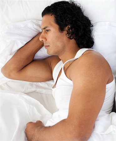 Upset man sleeping separately of his girlfriend after having an argument Stock Photo - Budget Royalty-Free & Subscription, Code: 400-04193483