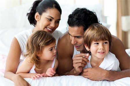 simsearch:400-04192370,k - Animated family having fun lying on bed at home Stock Photo - Budget Royalty-Free & Subscription, Code: 400-04193502