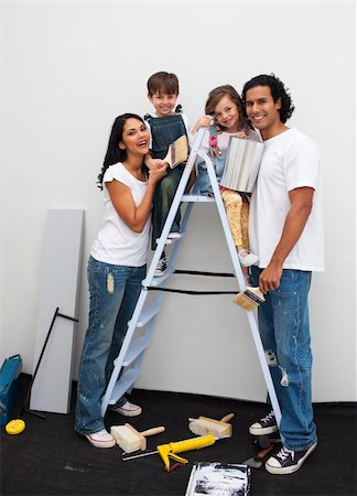 simsearch:400-04878558,k - Merry parents with their children painting a room in their house Stock Photo - Budget Royalty-Free & Subscription, Code: 400-04193527