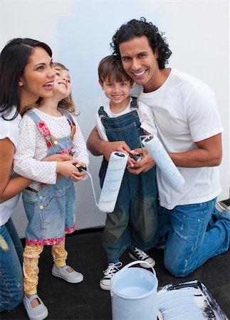 Cute children painting a room with their parents in their new house Stock Photo - Budget Royalty-Free & Subscription, Code: 400-04193520