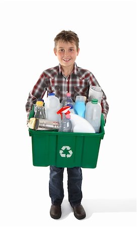 A child holds a recycling bin container full of tins, bottles and papers suitable for recycling.  White background. Stock Photo - Budget Royalty-Free & Subscription, Code: 400-04193706