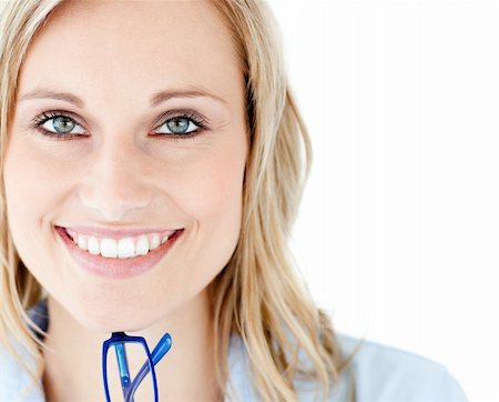 Close-up of a smiling woman holding glasses looking at the camera against white background Stock Photo - Budget Royalty-Free & Subscription, Code: 400-04204075