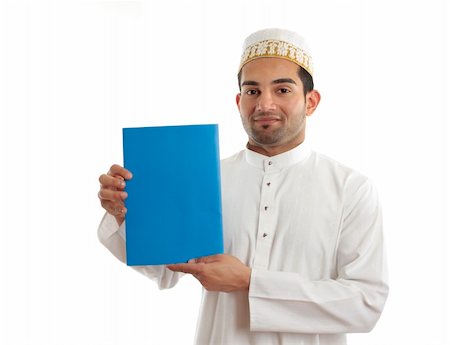 An arab italian mixed race businessman wearing traditional clothing is holding a booklet, message or brochure.  White background. Photographie de stock - Aubaine LD & Abonnement, Code: 400-04204134