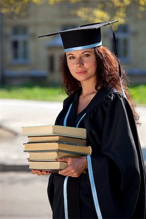simsearch:400-04705218,k - The graduate of university with books about library Stockbilder - Microstock & Abonnement, Bildnummer: 400-04204298