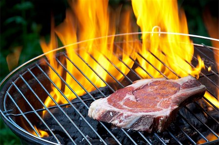 steak bbq flame - t bone steak on a grill outdoors Stock Photo - Budget Royalty-Free & Subscription, Code: 400-04204569