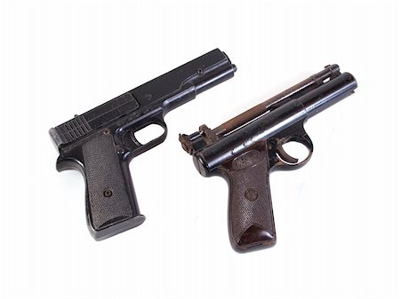 Old hand guns on a plain white background. Stock Photo - Budget Royalty-Free & Subscription, Code: 400-04204659