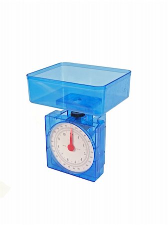 perfect balance - Food weighing scales on a plain white background. Photographie de stock - Aubaine LD & Abonnement, Code: 400-04204662