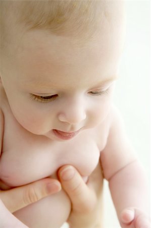 baby nude blond on mother arms white background Stock Photo - Budget Royalty-Free & Subscription, Code: 400-04204909