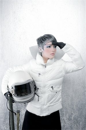 pilot pose - astronaut spaceship driver aircraft helmet fashion woman over silver Stock Photo - Budget Royalty-Free & Subscription, Code: 400-04204920