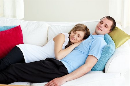 Loving couple sleeping lying on a sofa at home Stock Photo - Budget Royalty-Free & Subscription, Code: 400-04204936
