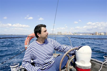 simsearch:6129-09044463,k - blue sailor man sailing vintage wooden sailboat mediterranean sea Stock Photo - Budget Royalty-Free & Subscription, Code: 400-04204947