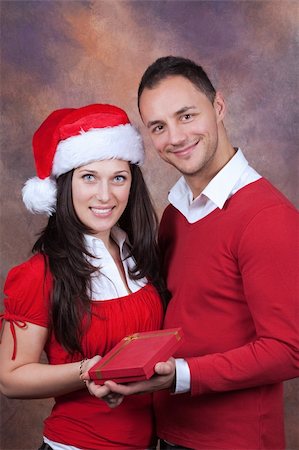 simsearch:400-04805110,k - happy young couple with christmas clothes and box gift Stock Photo - Budget Royalty-Free & Subscription, Code: 400-04205044