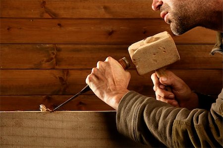 picture of old man construction worker - gouge wood chisel carpenter tool hammer in hand working wooden background Stock Photo - Budget Royalty-Free & Subscription, Code: 400-04205056