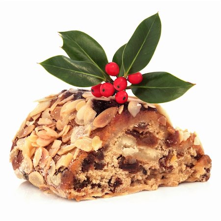 Stollen christmas cake with holly berry leaf sprig, isolated over white background. Stock Photo - Budget Royalty-Free & Subscription, Code: 400-04205114