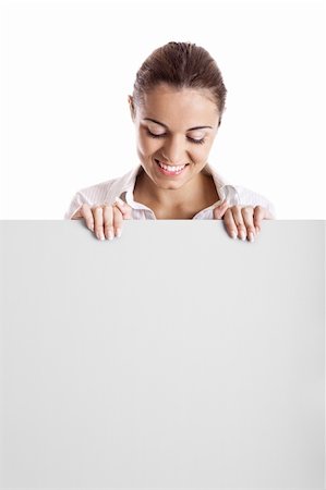 simsearch:400-05368656,k - Portrait of a beautiful woman holding and looking to a blank billboard Stockbilder - Microstock & Abonnement, Bildnummer: 400-04205139