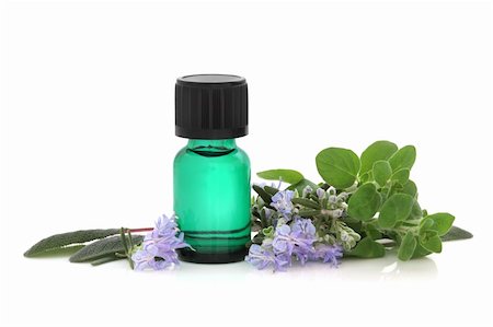 sage flower - Herb leaf sprigs of sage, oregano and rosemary leaf and flower sprigs with green aromatherapy essential oil glass bottle, isolated over white background with reflection. Stock Photo - Budget Royalty-Free & Subscription, Code: 400-04205367