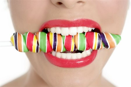 simsearch:400-04932642,k - Colorful Lollypop in perfect woman teeth and red lips mouth Foto de stock - Super Valor sin royalties y Suscripción, Código: 400-04205457
