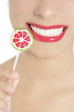 simsearch:400-04932642,k - Colorful Lollypop in perfect woman teeth and red lips mouth Foto de stock - Super Valor sin royalties y Suscripción, Código: 400-04205458