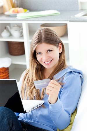 simsearch:6109-08395848,k - Happy woman with a credit card and a laptop Fotografie stock - Microstock e Abbonamento, Codice: 400-04205495