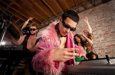 dance coat - Cool Asian DJ at a 1970s Disco Music Party Stock Photo - Budget Royalty-Free & Subscription, Code: 400-04205689