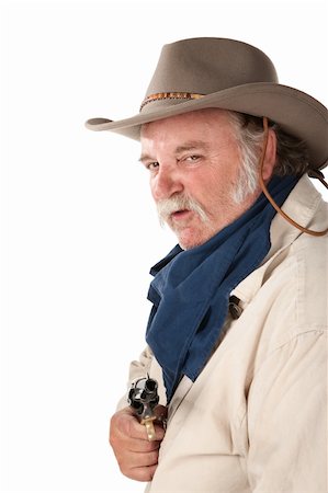 Big tough cowboy with pistol on white background Stock Photo - Budget Royalty-Free & Subscription, Code: 400-04205702