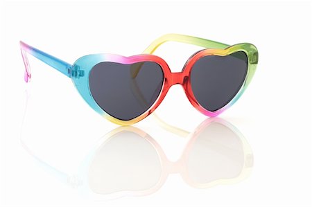 Heart shaped rainbow coloured sunglasses, isolated over white background with reflection. Photographie de stock - Aubaine LD & Abonnement, Code: 400-04205905