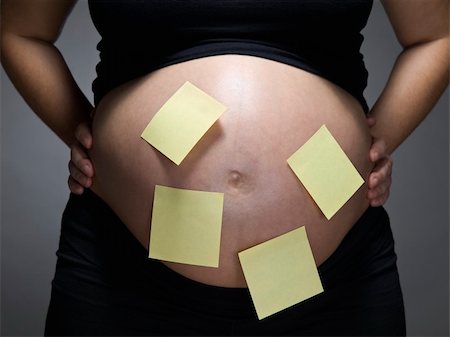 simsearch:400-04205919,k - Pregnant woman with blank sticky notes on her belly. Stock Photo - Budget Royalty-Free & Subscription, Code: 400-04205919