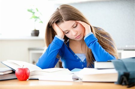 Young girl studing in living room at home Stock Photo - Budget Royalty-Free & Subscription, Code: 400-04206162