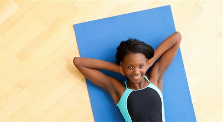 Smiling woman doing fitness in gym Stock Photo - Budget Royalty-Free & Subscription, Code: 400-04206176