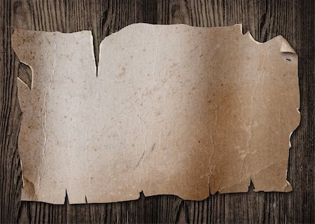 Old paper sheet on a wooden surface. Stock Photo - Budget Royalty-Free & Subscription, Code: 400-04207952