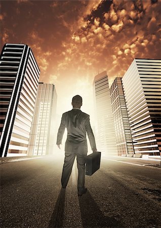A businessman heading into a new city, exploring new opportunities. Stock Photo - Budget Royalty-Free & Subscription, Code: 400-04208224