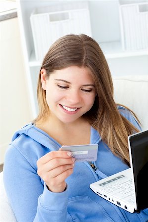 simsearch:6109-08395848,k - Happy woman with a credit card and a laptop Fotografie stock - Microstock e Abbonamento, Codice: 400-04208763