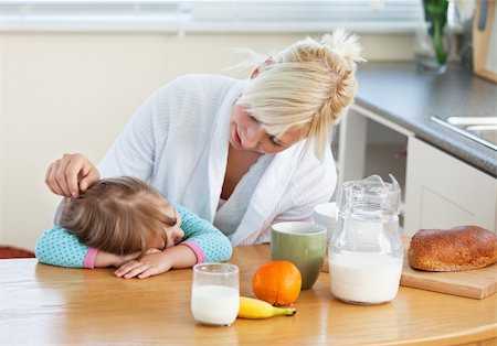Blond mother and daughter having breakfast in kitchen Stock Photo - Budget Royalty-Free & Subscription, Code: 400-04208794