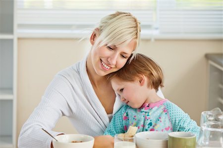 Fortunate mother with her daughter in kitchen Stock Photo - Budget Royalty-Free & Subscription, Code: 400-04208792