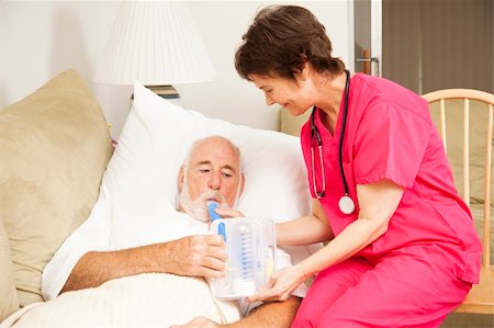 pneumonia - Home health nurse helps a senior patient with his respiratory therapy. Stock Photo - Budget Royalty-Free & Subscription, Code: 400-04208983