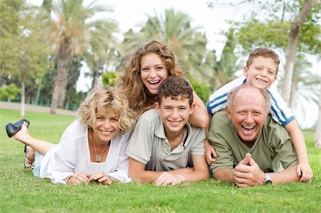 Multi-generation family enjoying sunny day in park and having fun Stock Photo - Budget Royalty-Free & Subscription, Code: 400-04209147