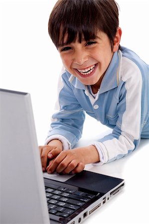 simsearch:400-05745952,k - Cute smiling caucasian kid with laptop on isolated white background Stock Photo - Budget Royalty-Free & Subscription, Code: 400-04209290