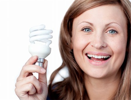 simsearch:695-05770898,k - Cheerful woman holding a light bulb against white background Foto de stock - Super Valor sin royalties y Suscripción, Código: 400-04209940