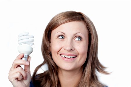 simsearch:695-05770898,k - Bright woman holding a light bulb against white background Foto de stock - Super Valor sin royalties y Suscripción, Código: 400-04209942