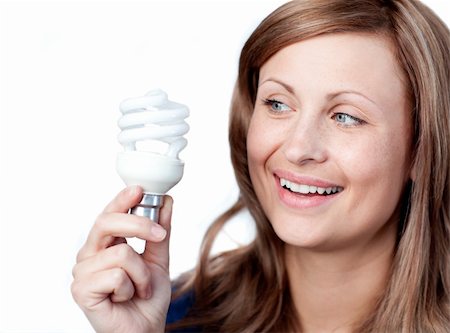 simsearch:695-05770898,k - Smiling young woman holding a light bulb against white background Foto de stock - Super Valor sin royalties y Suscripción, Código: 400-04209943
