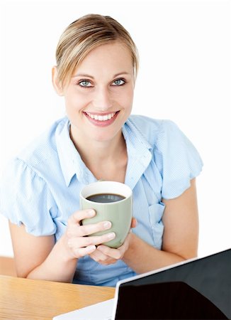 simsearch:400-05741872,k - Glowing businesswoman drinking coffee smilng at the camera sitting against white background Stock Photo - Budget Royalty-Free & Subscription, Code: 400-04209954