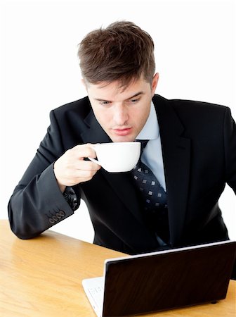 simsearch:400-05737647,k - Stressed young businesswoman drinking coffee and using his laptop at the morning Stock Photo - Budget Royalty-Free & Subscription, Code: 400-04209952