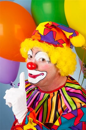 simsearch:400-04408991,k - Clown with a secret, holding his finger to his lips. Foto de stock - Super Valor sin royalties y Suscripción, Código: 400-04200009