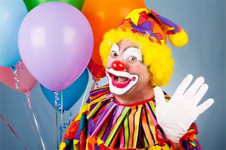 simsearch:400-04408991,k - Happy clown with helium balloons, waving hello. Foto de stock - Super Valor sin royalties y Suscripción, Código: 400-04200017