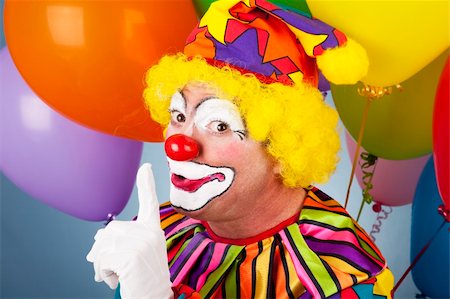 simsearch:400-04408991,k - A colorful clown putting his finger to his lips so you will be quiet. Foto de stock - Super Valor sin royalties y Suscripción, Código: 400-04200026