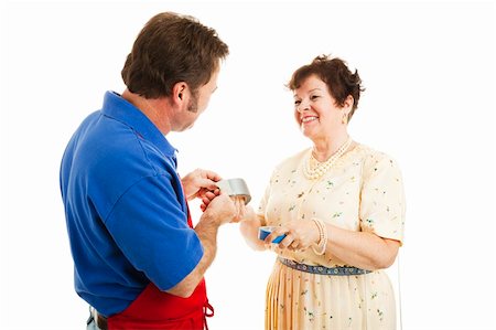 Salesman in a hardware store advises a woman on which tape is right for the job.  Isolated on white. Foto de stock - Super Valor sin royalties y Suscripción, Código: 400-04200039