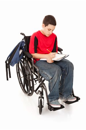 Disabled teenage boy doing homework in his wheelchair.  Full body isolated. Stock Photo - Budget Royalty-Free & Subscription, Code: 400-04200047